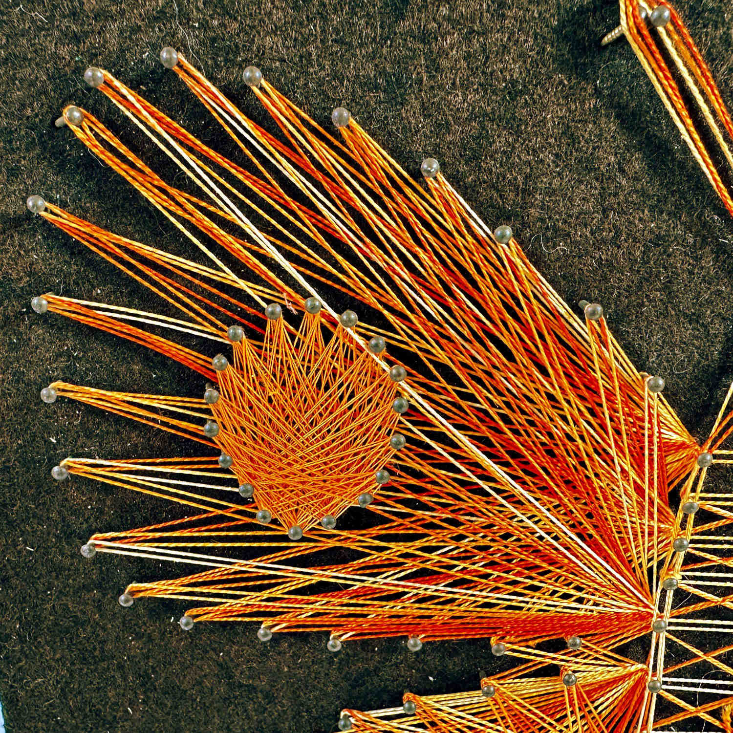 Detail of butterfly wing corner showing thread intersection and dimensional construction technique