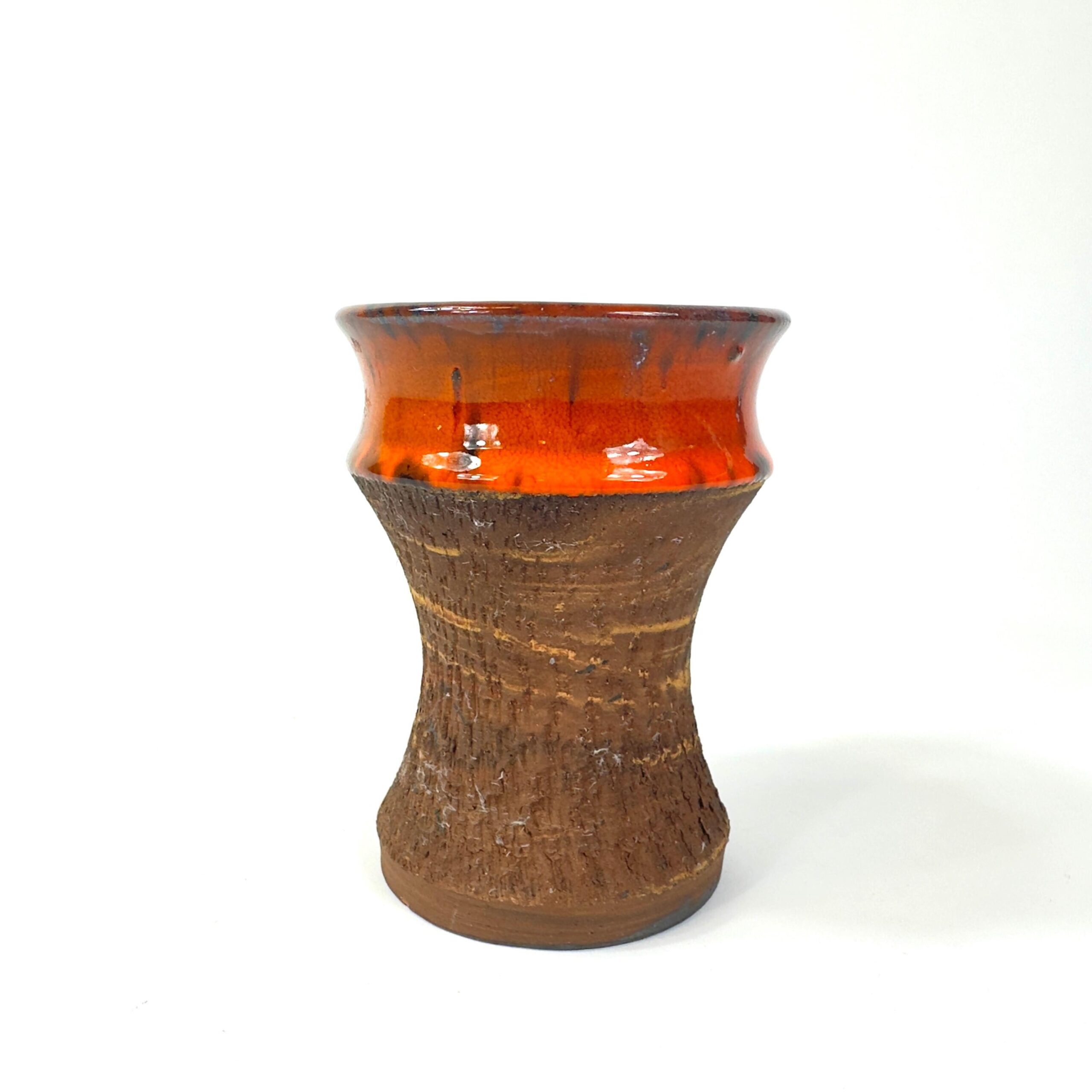 Direct view Danish studio vase orange drip glaze band on brown stoneware, minimal background
