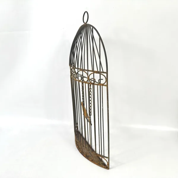 Elongated side view of birdcage showing depth dimension, rectangular base, and aged brass patina detail