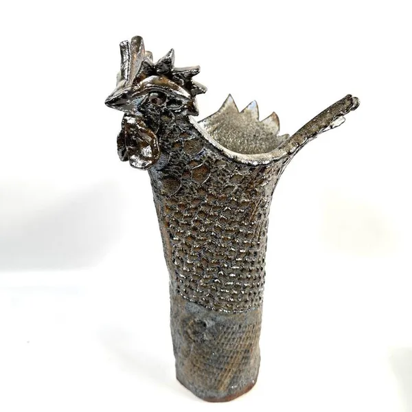 Empty rooster vase three-quarter view showing full sculptural form, tail opening, and detailed textured glaze work without pl