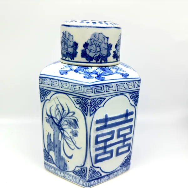 Ginger jar side view showing peony and floral panel designs in cobalt blue on cream porcelain