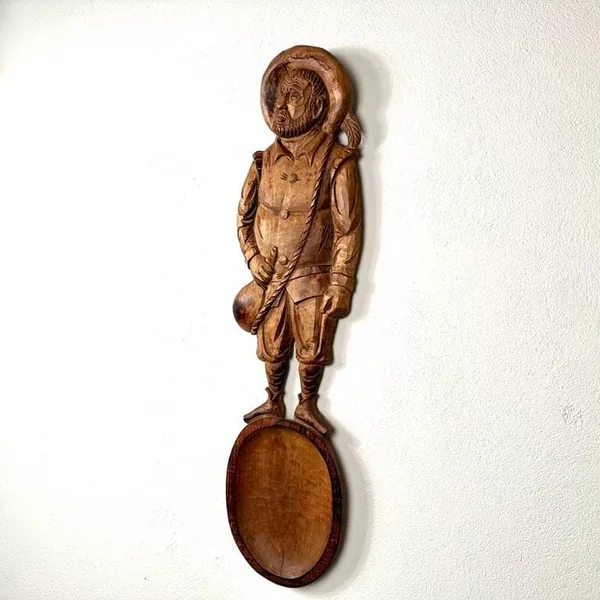 Hand-carved wooden Sancho Panza sculpture, 79cm tall, mounted on oval base, full frontal view showing period clothing and exp