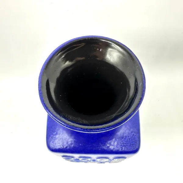 Interior opening of blue ceramic vase showing rim detail, glaze color, and functional hollow form
