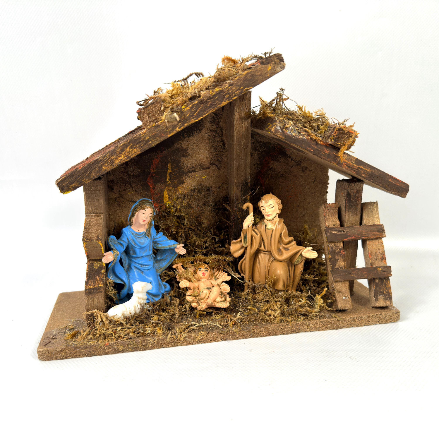 Italian 1970s wooden nativity manger with hand-painted figures, moss detailing, front view