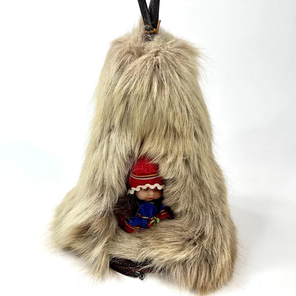 Lapland folk art teepee from front showing complete doll figure in blue fabric tunic and red embroidered hat inside natural f