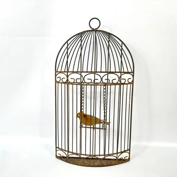 Metal birdcage wall hanging shown straight-on, displaying brass bird suspended by chains inside wire dome frame