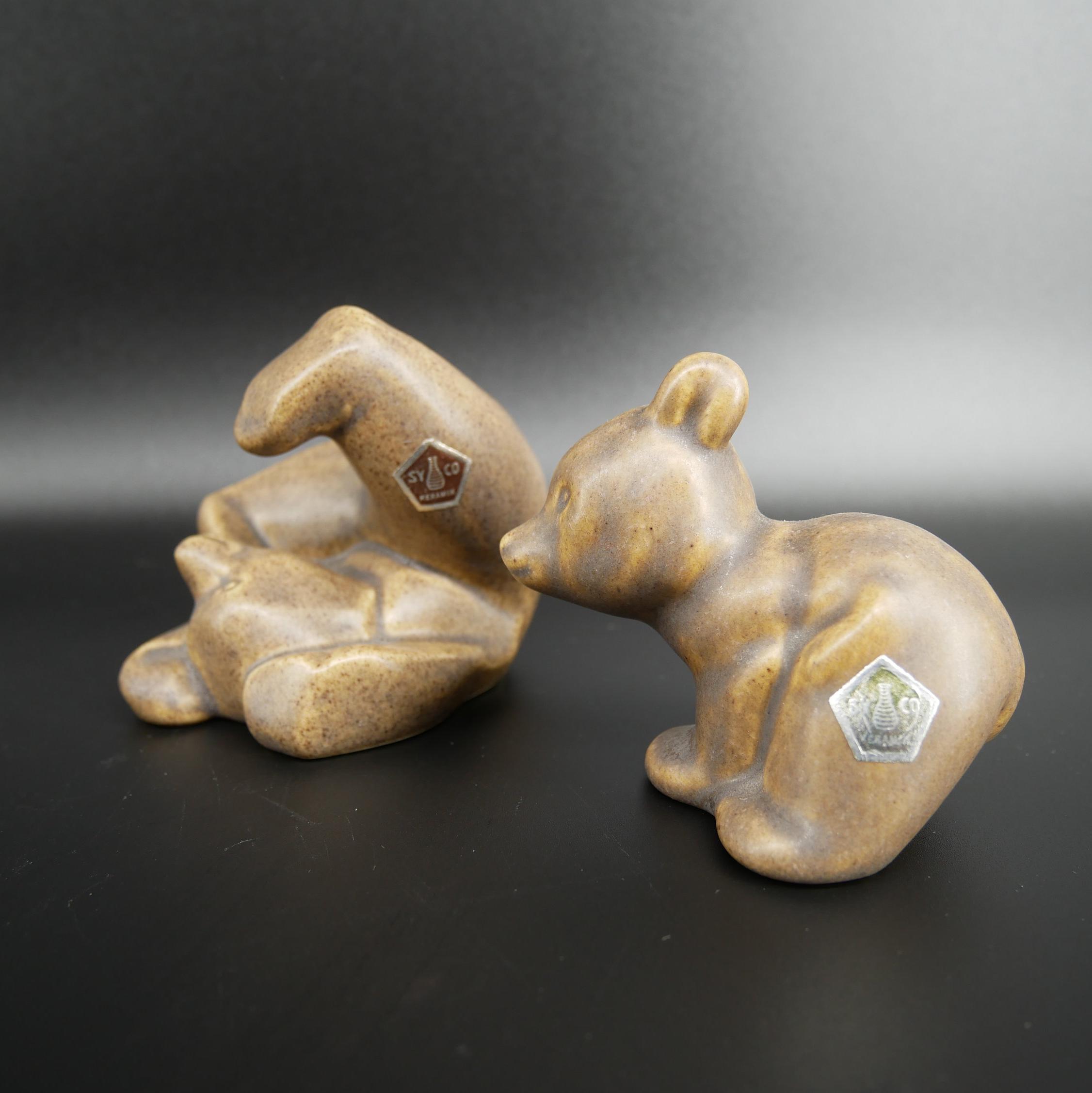 Pair of vintage ceramic bears by Syco Pottery, golden-tan glaze, playful tumbling pose, Scandinavian mid-century design