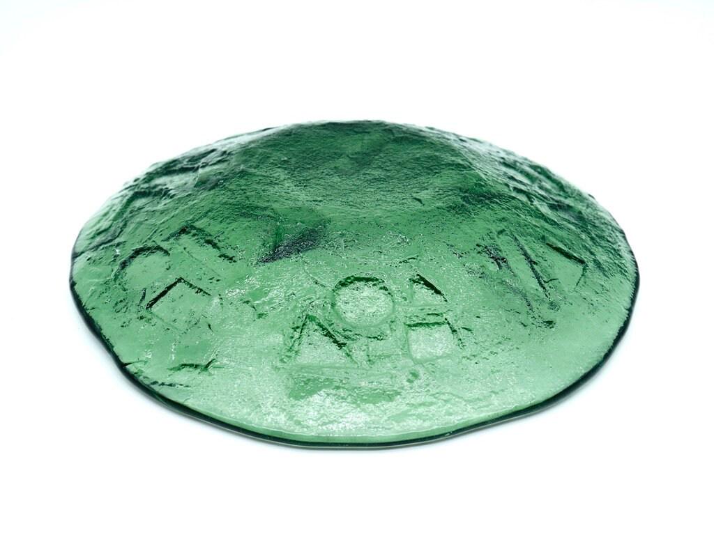 Ruda green dessert plate bottom-up angle showing geometric relief texture and maker marks