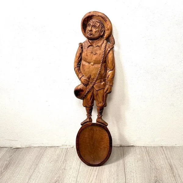 Sancho Panza wooden figure lower body and feet detail, boot carving, standing posture, base mounting visible