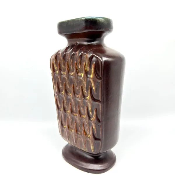Scheurich pottery vase angled side view showing full chevron texture coverage, warm ochre tones, and dark brown base
