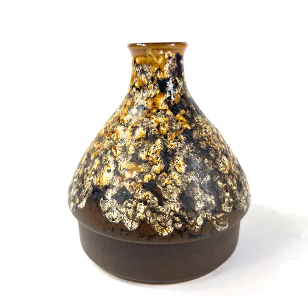 Side profile of brown ceramic vase with golden lava glaze dripping asymmetrically down body