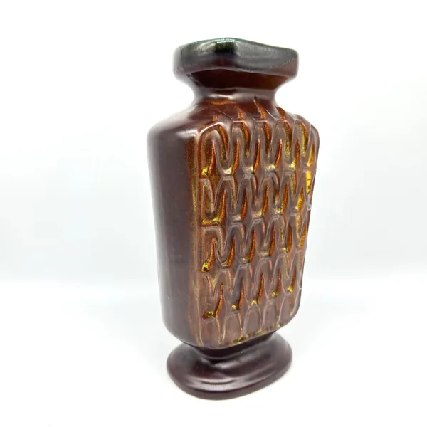 Side profile of Scheurich vase displaying angular pedestal base, chevron relief pattern, and smooth brown satin finish