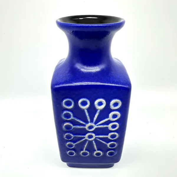 Sputnik vase turned view showing geometric pattern continuation, cylindrical neck, and flared opening