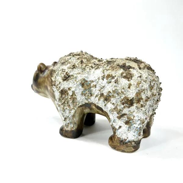 Stoneware bear viewed from three-quarter angle, displaying full sculptural form with substantial body and sturdy ceramic legs