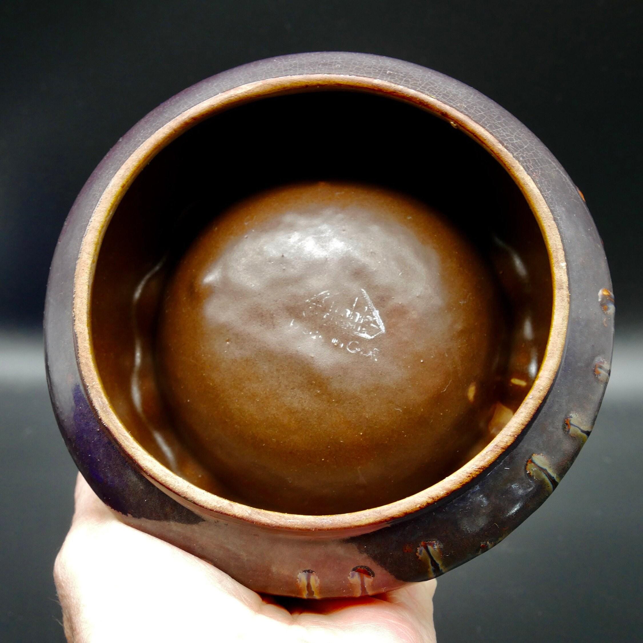 Strehla ashtray interior close-up, pale clay surface, brown glaze rim, aged patina detail