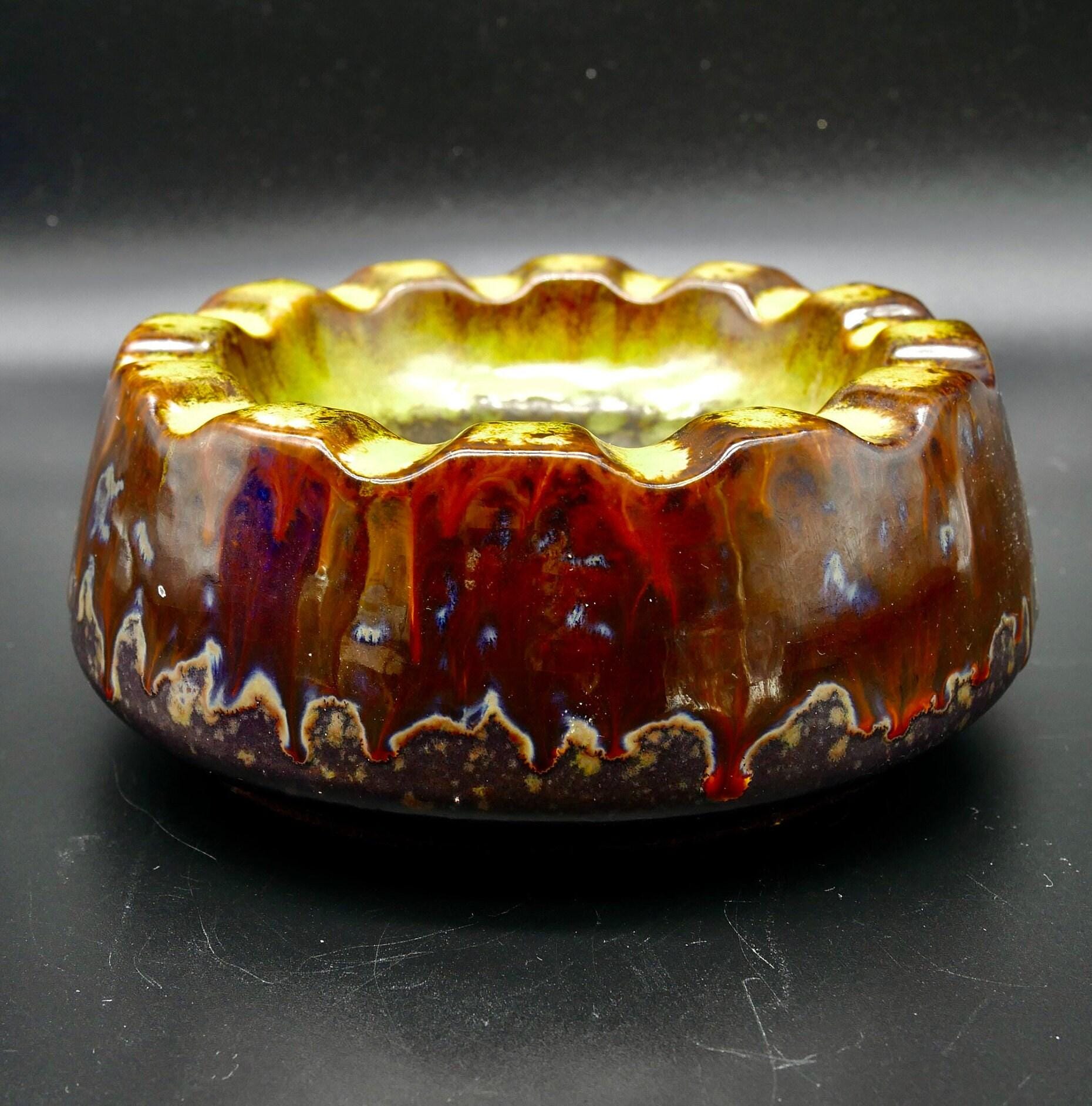 Strehla ashtray side profile, fat lava glaze flowing down ceramic sides, textured surface patterns