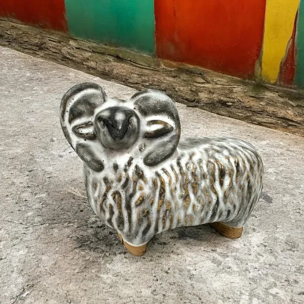 Szilasi ceramic sheep in outdoor setting with colorful backdrop showing vintage collectible condition