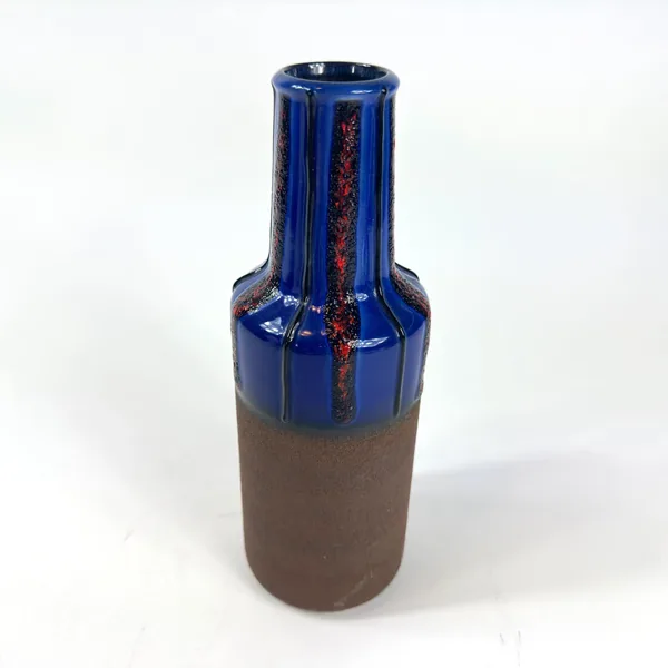Three-quarter view of vintage ceramic vase showing cylindrical neck, pronounced shoulder, and contrasting glazed-unglazed tra