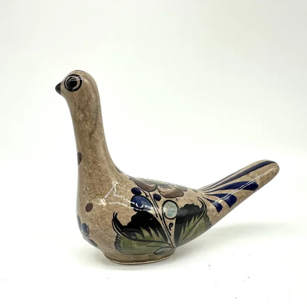 Tonalá pottery bird full-profile view, showing complete sculptural silhouette with painted details and natural clay patina