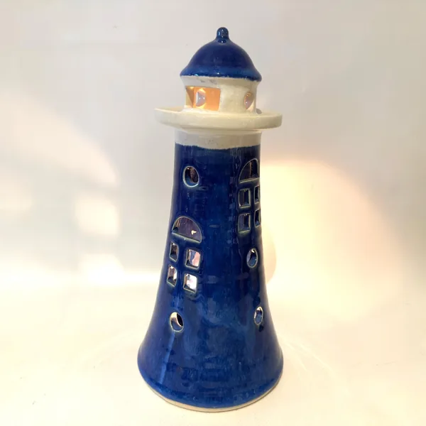 Vintage ceramic lighthouse candle holder, 24cm tall, cobalt blue with cream band and navy dome top, front-facing view