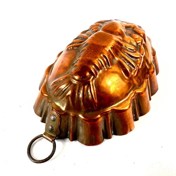 Vintage copper lobster mold with detailed relief carving, scalloped rim, and hanging ring, front view