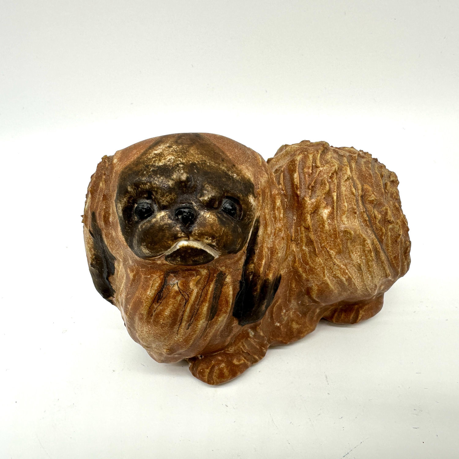 Vintage JIE Gantofta Pekingese figurine in golden-brown stoneware with hand-carved fur texture and expressive face, front thr