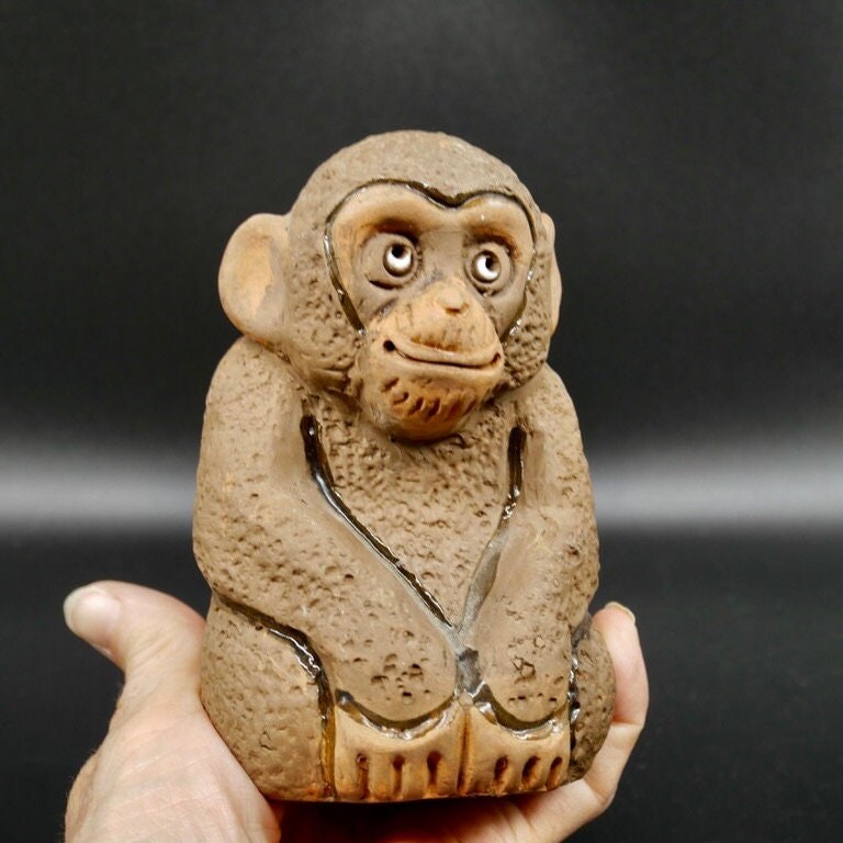 Vintage Swedish pottery monkey by TB, 1970s, seated front view with expressive eyes and textured cream clay body