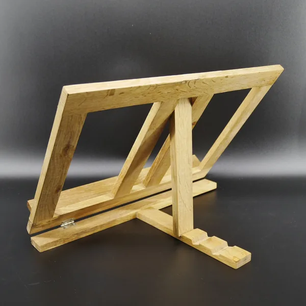 Wooden book stand in profile view, tilted position showing natural wood construction, hinged support leg, and minimalist fram
