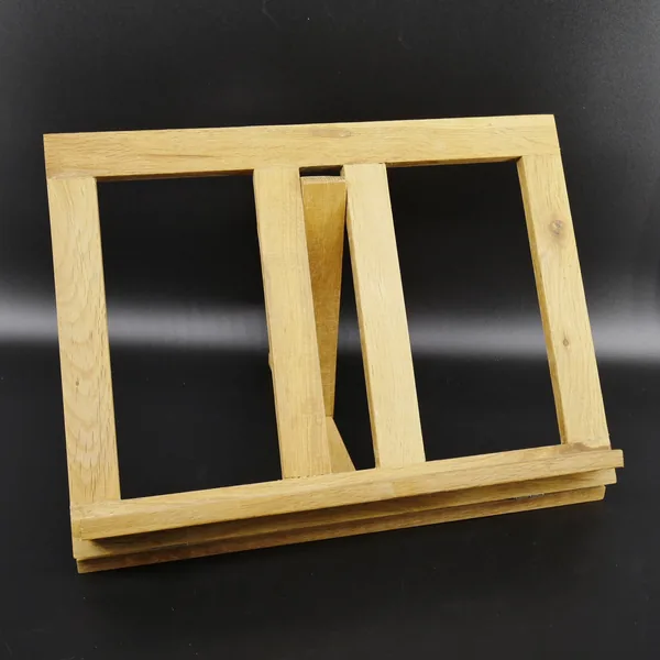 Wooden reading stand flat position, overhead angle showing dual rectangular frames, central divider, and horizontal base stru