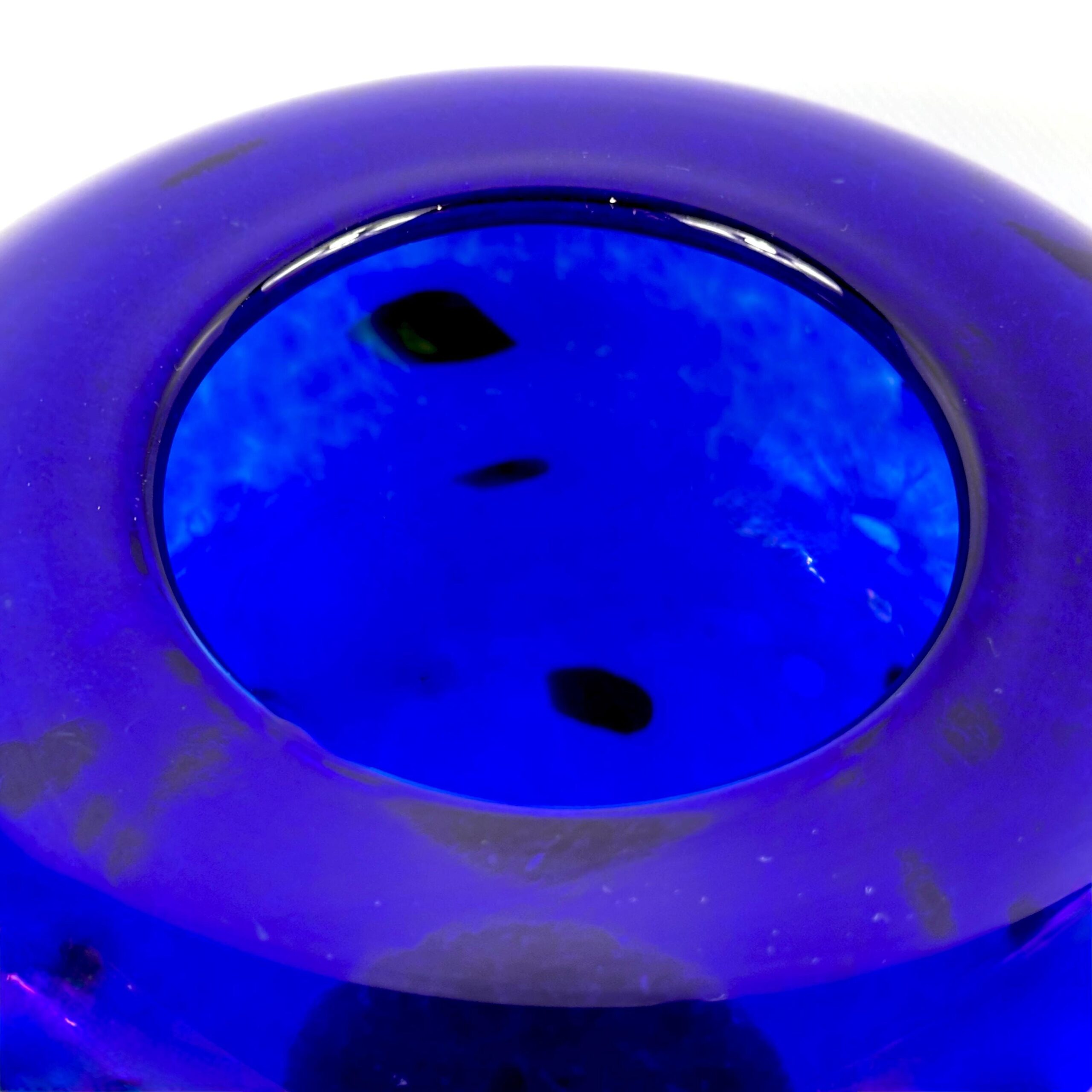 Close-up angled view of rim and upper bowl showing color transitions from purple to blue glass