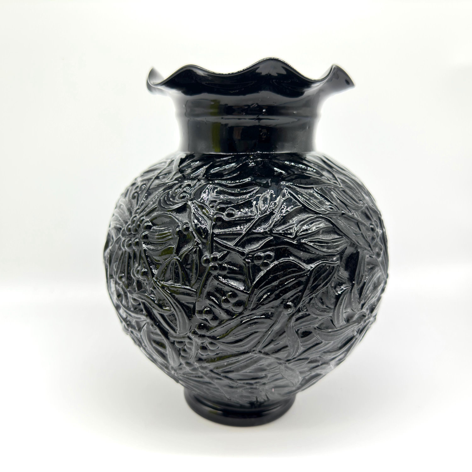 Edvin Ollers black glass vase, 1930s, with raised floral relief pattern and scalloped rim, front view