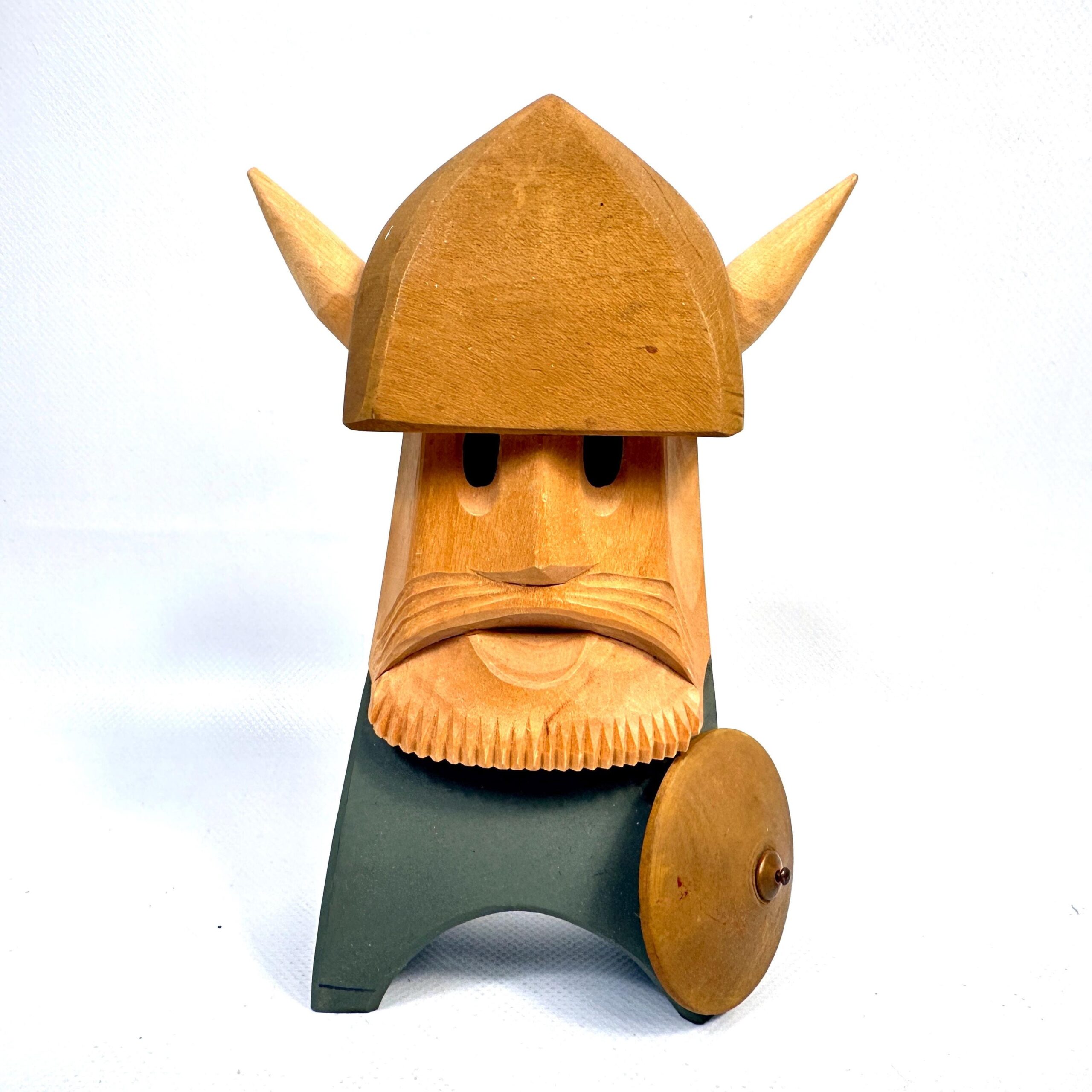 Hand-carved wooden Viking figure with horned helmet, carved face, shield, and muted green paint, front view
