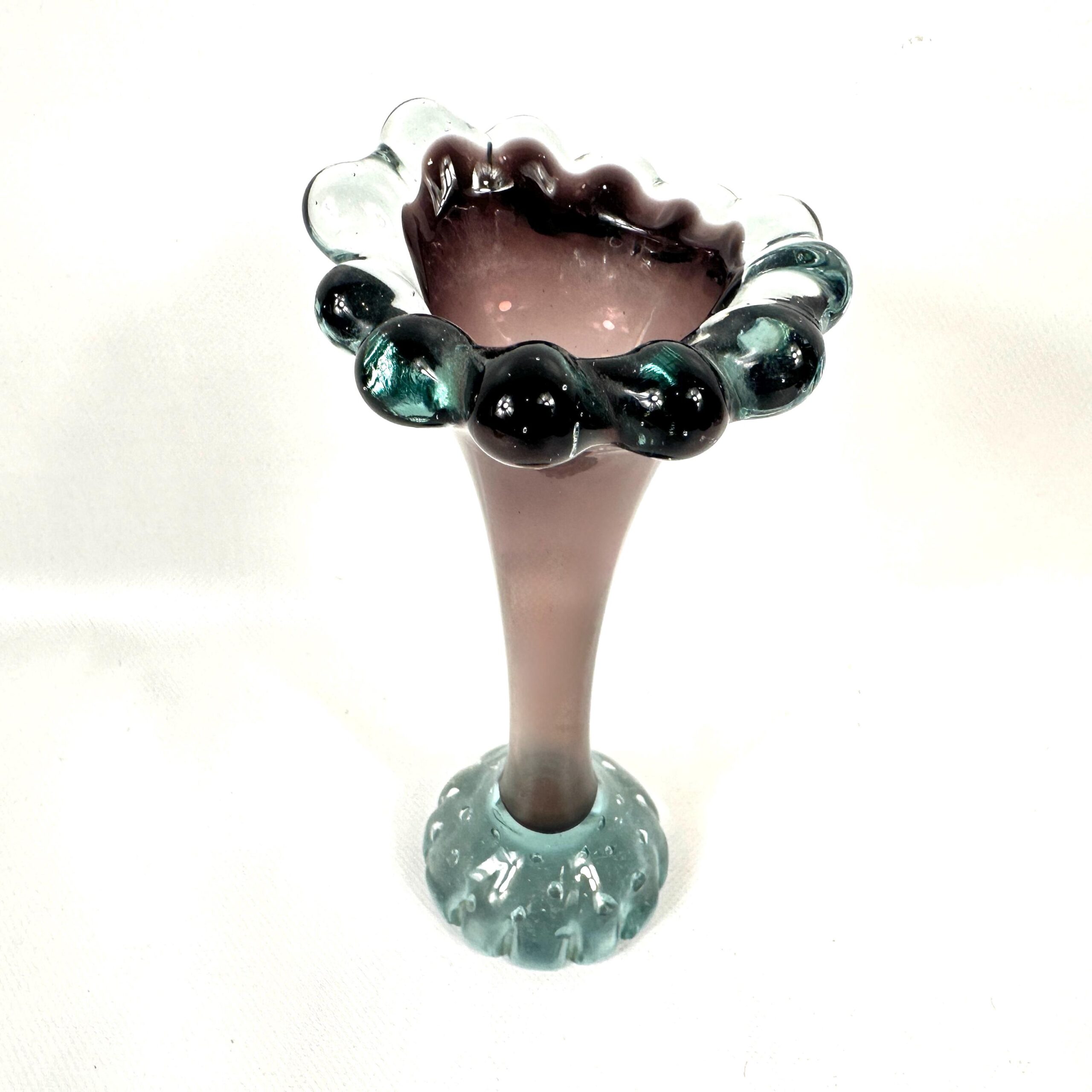 Inside view of Åseda vase opening displaying interior lilac walls and bubble rim