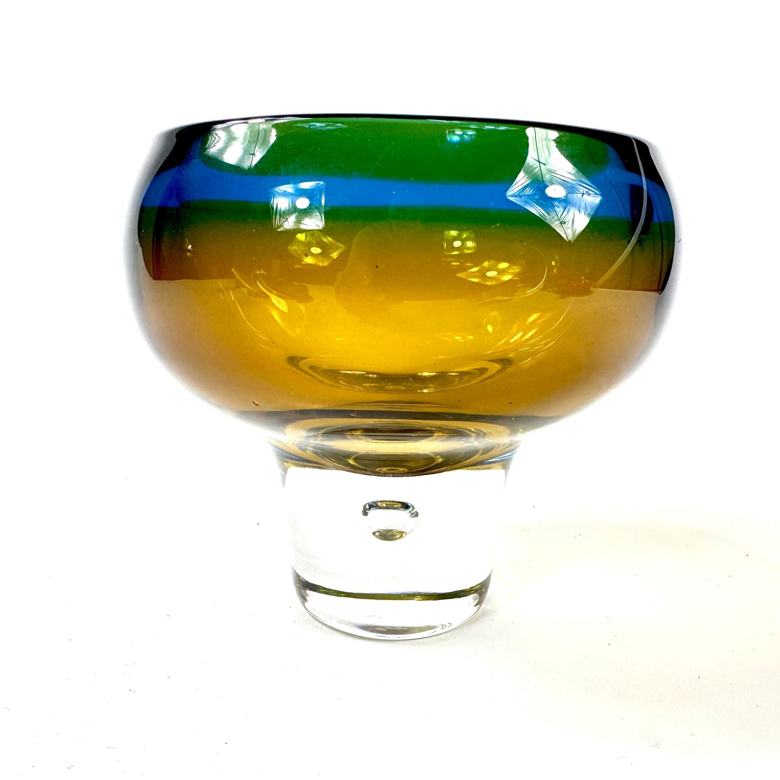Kosta Boda art glass vase by Vicke Lindstrand with layered amber, green, and blue sommerso glass, clear pedestal base