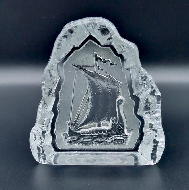 Nybro Sweden glass Viking ship paperweight, clear thick crystal with textured border, front-facing view showing sailboat reli