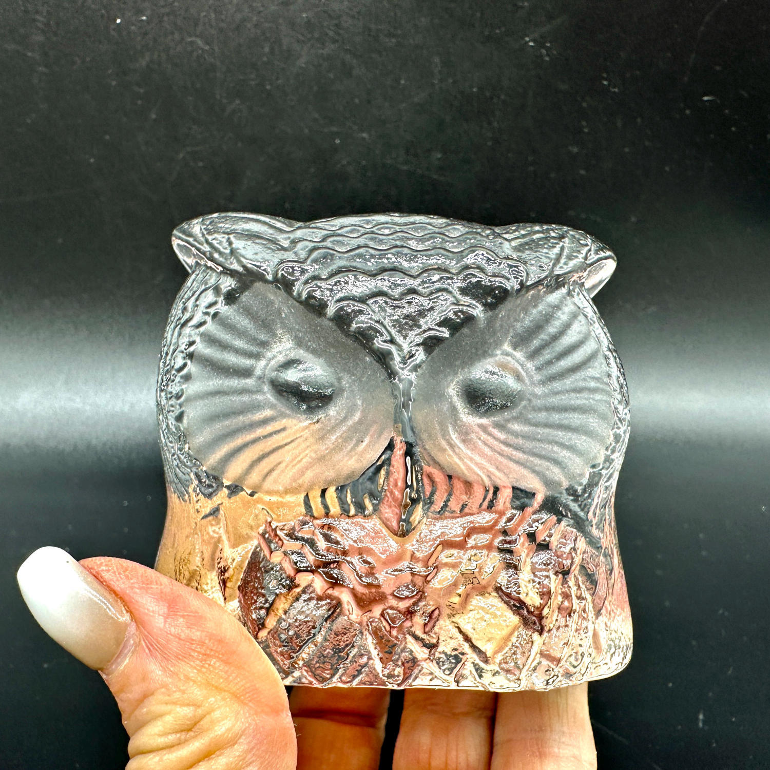 Nybro Swedish art glass owl figurine, clear textured crystal with detailed feathering and large stylised eyes, held in hand