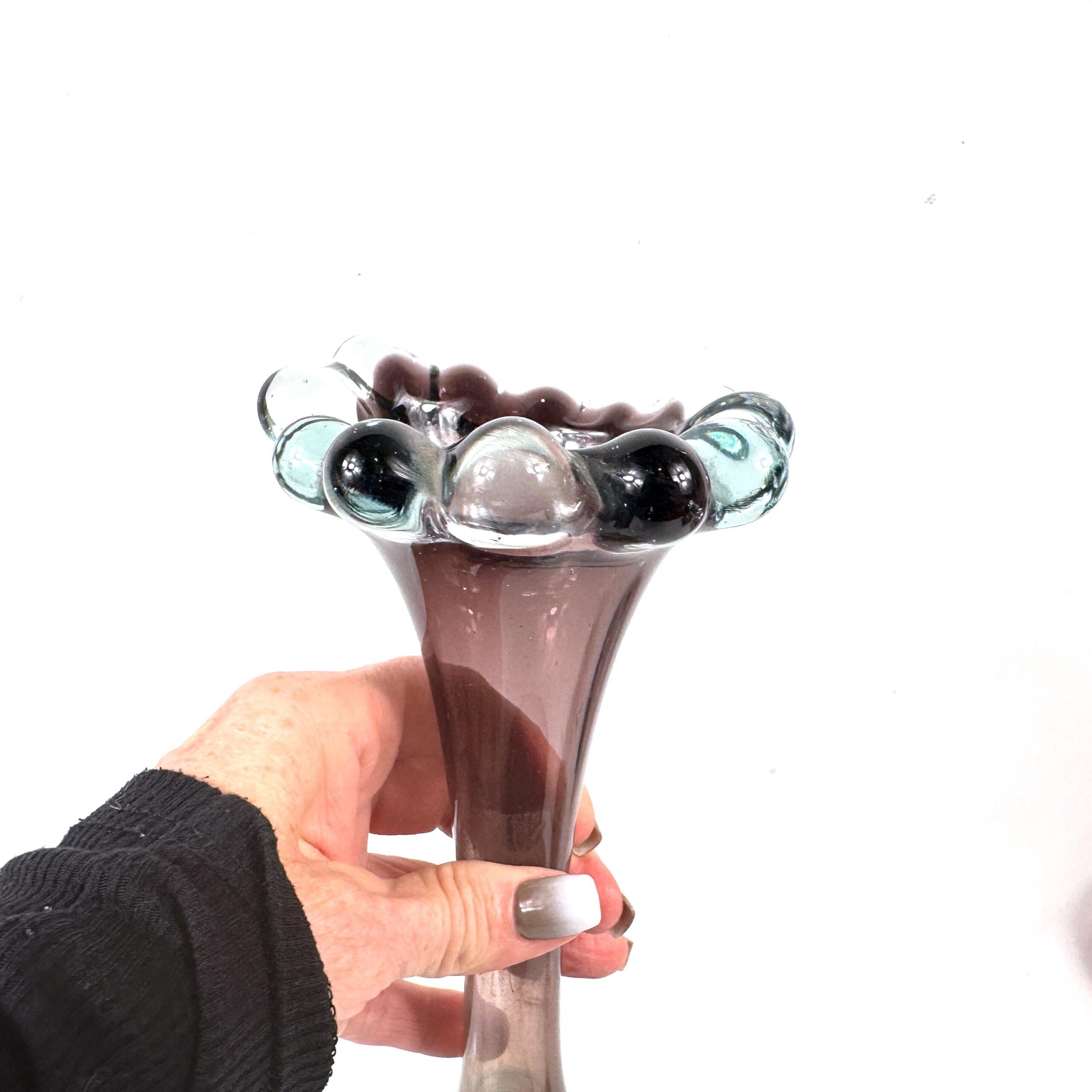 Profile view with hand showing taper from bubble rim to aqua base
