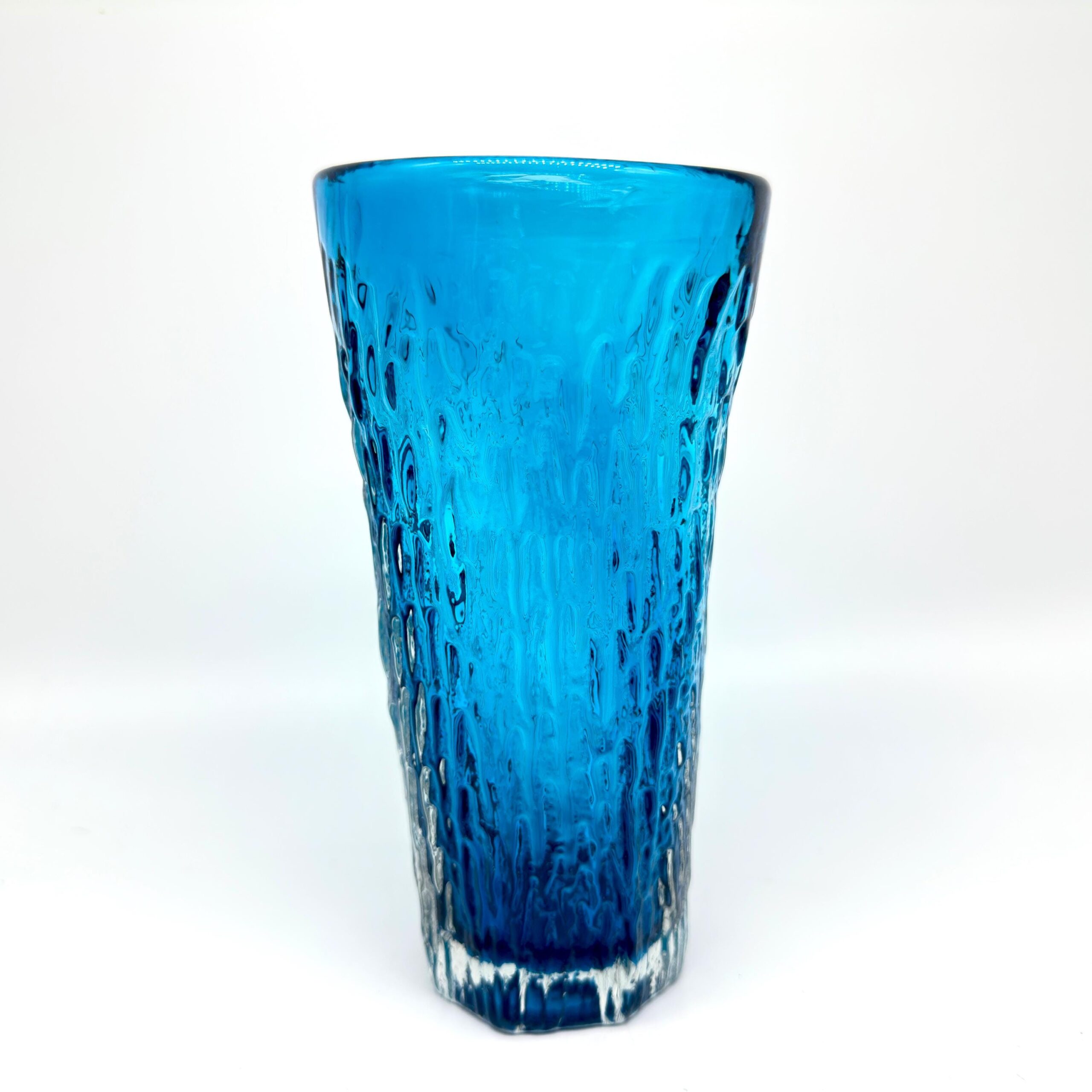 Scandinavian ice blue art glass vase with textured bark surface, 17cm tall, front view against white background