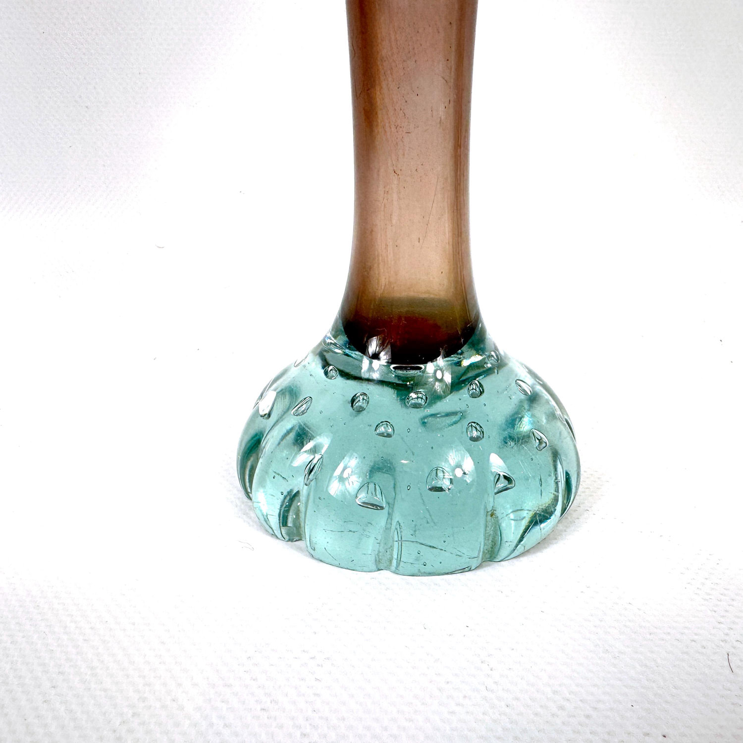 Textured aqua base of vintage Swedish Åseda vase showing molded detail