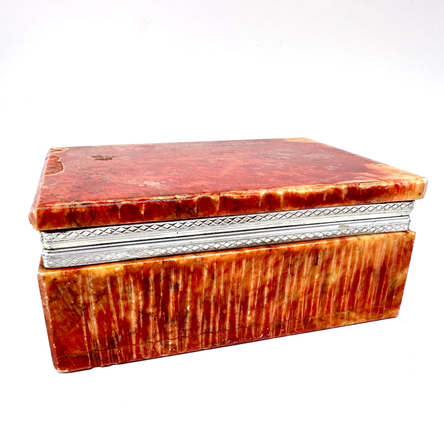 Vintage Italian red alabaster trinket box with warm amber marbling, silver-tone metal trim, closed view showing textured ston