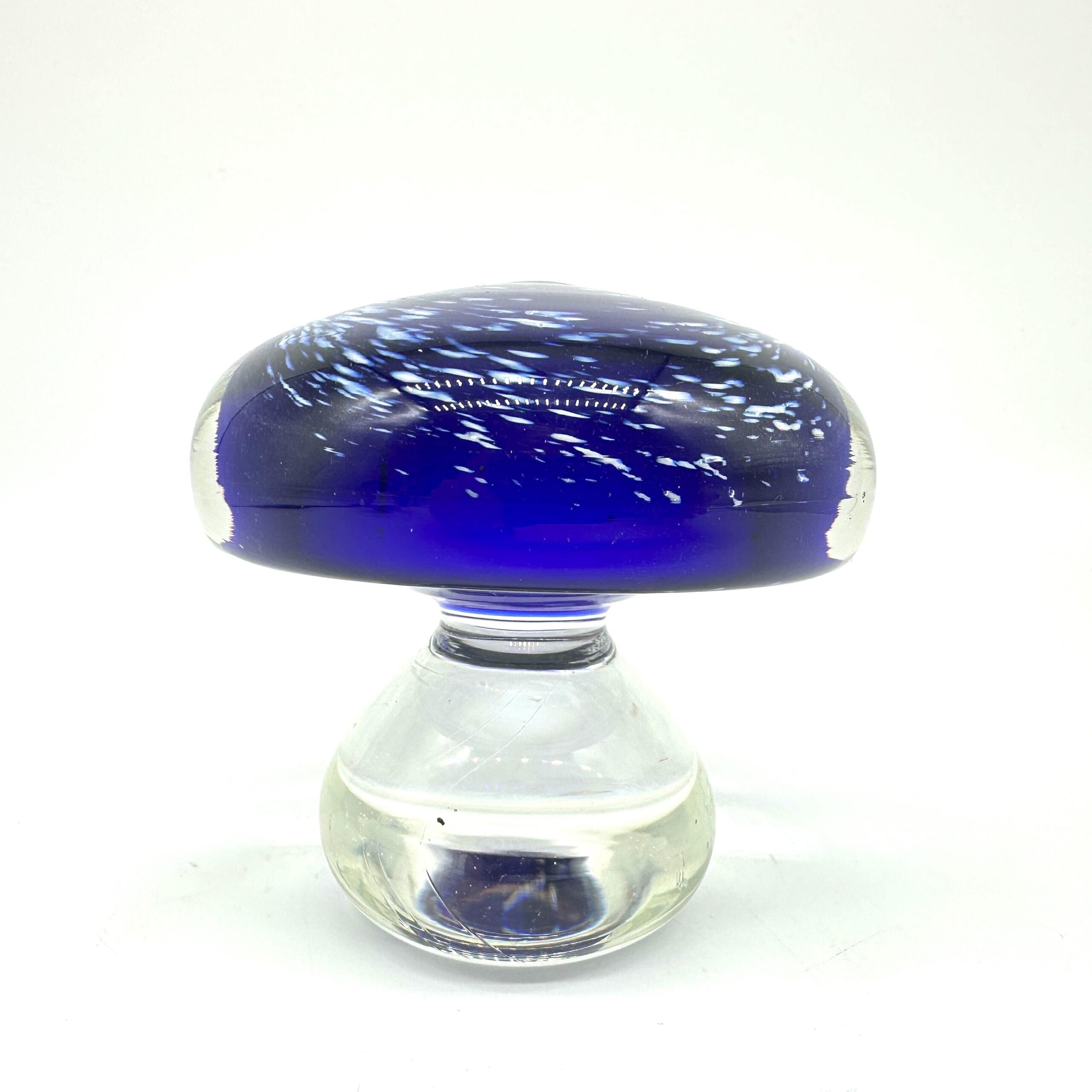 Vintage Scandinavian hand-blown cobalt blue glass mushroom with swirled white bubble cap and clear glass base, front view