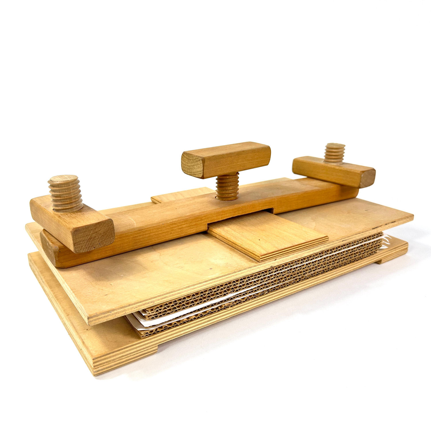 Wooden flower press with triple screw clamps, natural wood construction, overhead view showing full assembly with layered boa