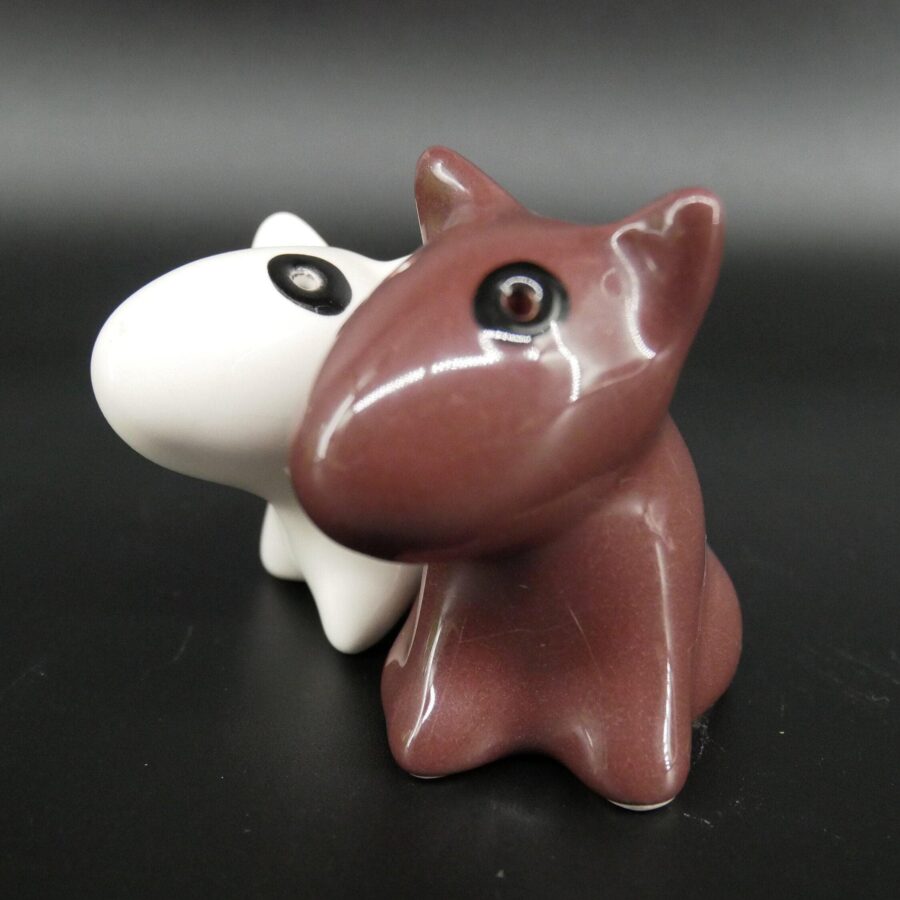 A charming pair of glossy ceramic bull terriers in warm burgundy and crisp white—the perfect nostalgic touch for any kitchen. Vintage bull terrier ceramic salt and pepper shakers, burgundy and white glazed porcelain, 1980s cruet set pair