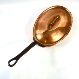 Vintage French copper oval pan with tin-lined interior and black riveted steel handle, stamped Made in France