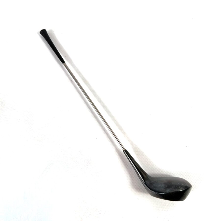 Vintage Frigast Denmark golf club cocktail stirrer with silver shaft and black sculptural head, full length profile view