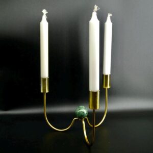Three-arm brass candelabra with green marble sphere center and cream taper candles, mid-century design