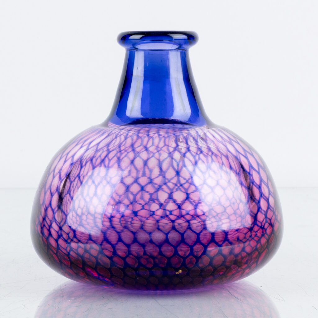 Clear or pale blue glass cylinder with elegant tapered form and subtle soft colouration, minimal decoration.