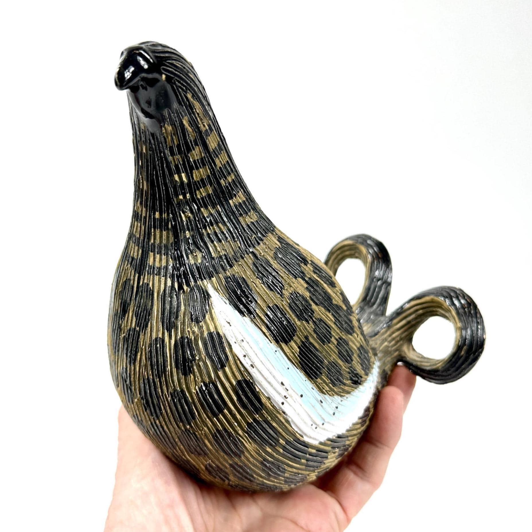 Black Grouse ceramic sculpture by Olle Alberius, Syco Sweden, held in hand showing textured plumage and curved tail handles