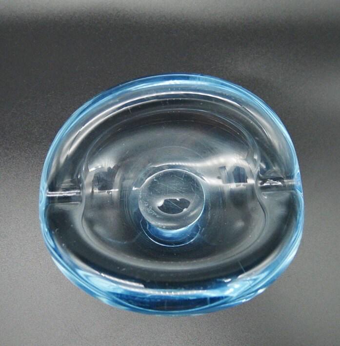 Bottom view of signed Holmegaard bowl showing Per Lütken's etched signature mark on crystal base