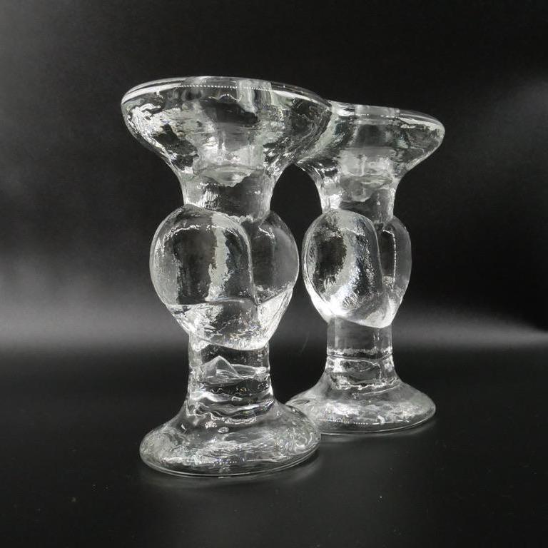 Closer view of individual candleholder showing pressed glass heart motif, textured finish, and pedestal base detail